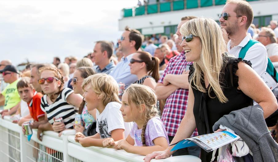 Crowds cheer on horseracing at Great Yarmouth Racecourse
