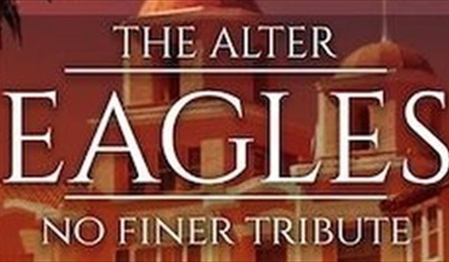 "Poster with text 'The Alter Eagles, No Finer Tribute' over a vintage building backdrop, conveying a classic rock tribute band theme."