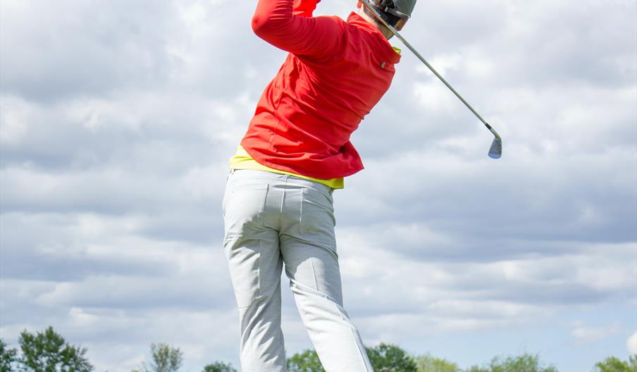 Golf hitting ball