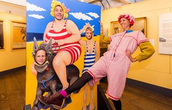 A family enjoying seaside themed dress-up fun