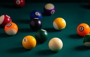 billiard balls on a billiard table