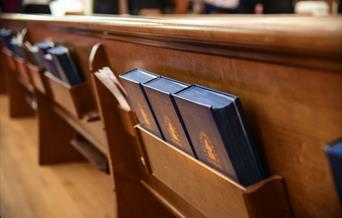 Bible at the back of bench