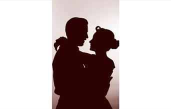 Silhouetted couple embracing, faces close, set against a soft gradient background. The image conveys intimacy and romance, with a nostalgic tone.