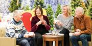 Two couples enjoy a coffee break at Potters Resorts Hopton-on-Sea