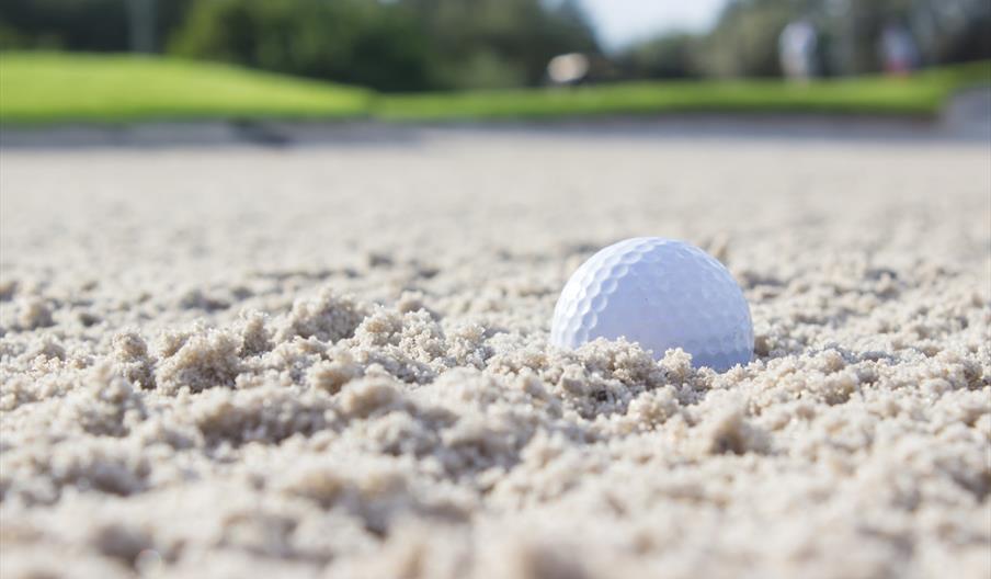 Golf ball in sand